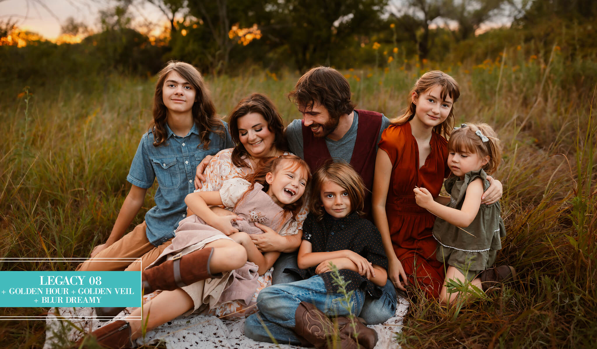 A family of six posing together outdoors in a grassy field at sunset, edited with Legacy Lightroom Presets from Pretty Presets